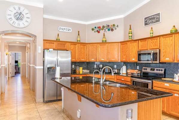 Bright kitchen with wooden cabinets and stainless steel appliances