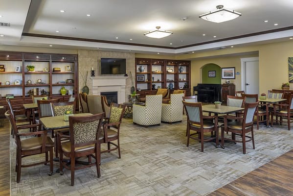 A cozy dining area with seating and shelves
