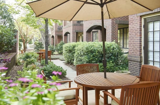 A serene outdoor seating area with tables and umbrellas