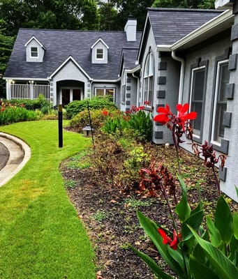 Exterior view of Oak Leaf Manor with vibrant flowers