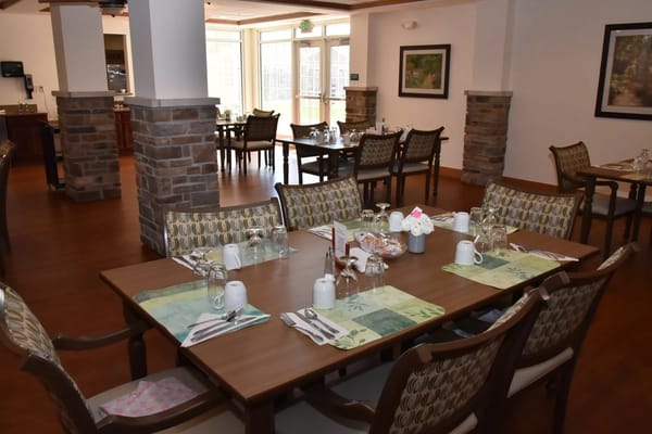 Bright dining room with tables set for meals