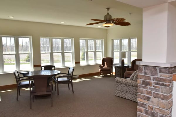 Bright common area with seating and a table