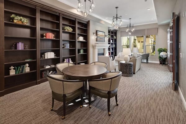 Cozy common area with seating and bookshelves