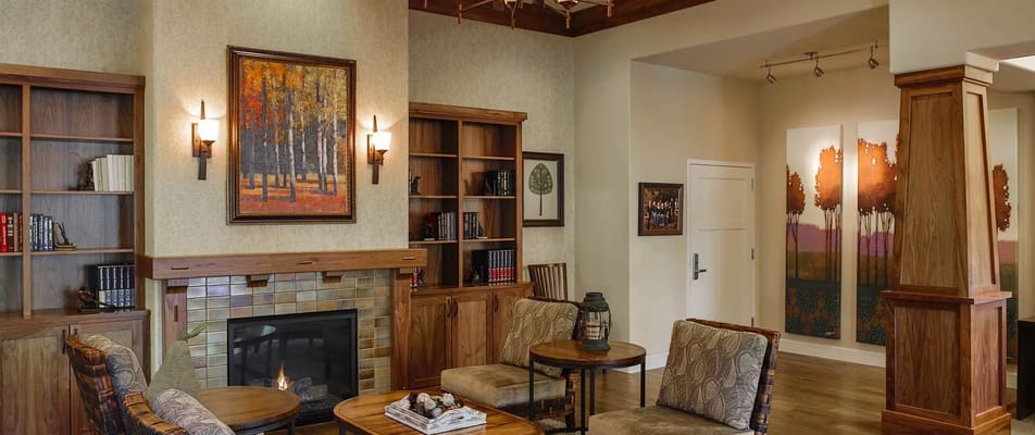 Inviting living room with fireplace and bookshelves