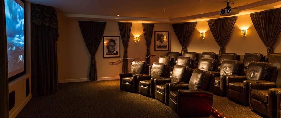 Leather recliners arranged in a cozy movie theater setting