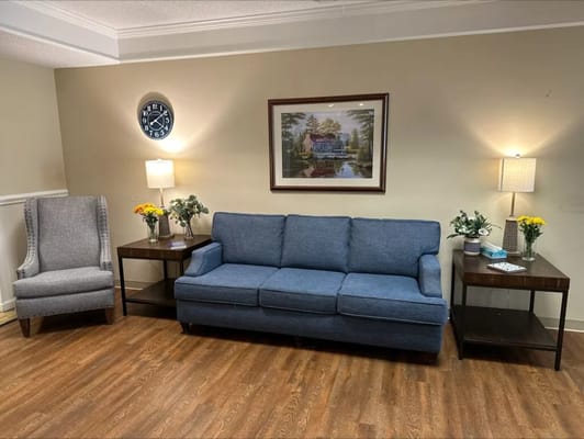 Cozy common area with seating and decor in a senior living facility