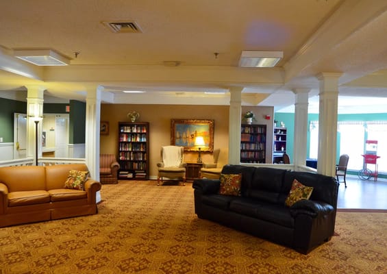 Common area with seating and bookshelves