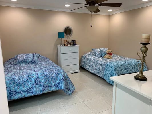 Bright interior of a shared resident room with two beds