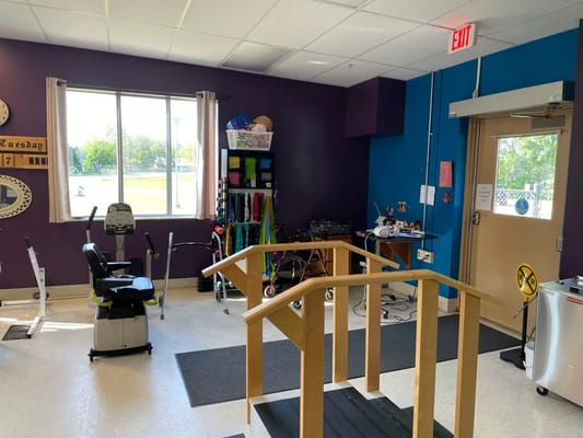 Therapy area with exercise equipment and accessible ramp