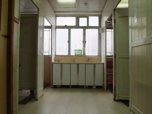 Bright bathroom space with sinks and windows
