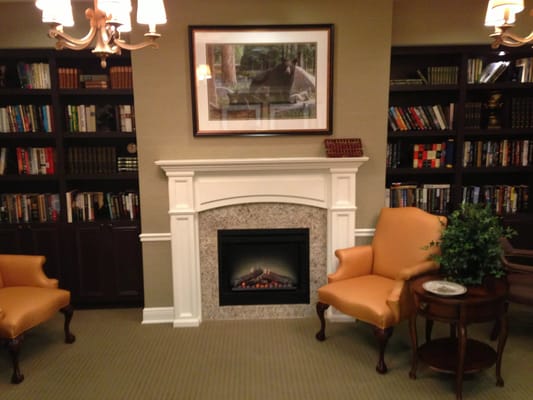Cozy common area with bookshelves and seating