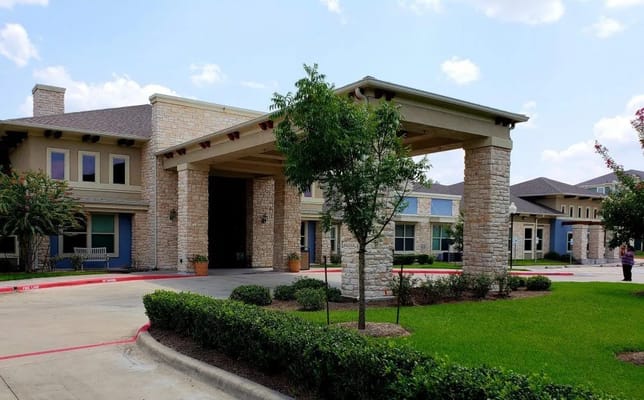 Entrance of Orchard Park at Southfork with landscaped surroundings