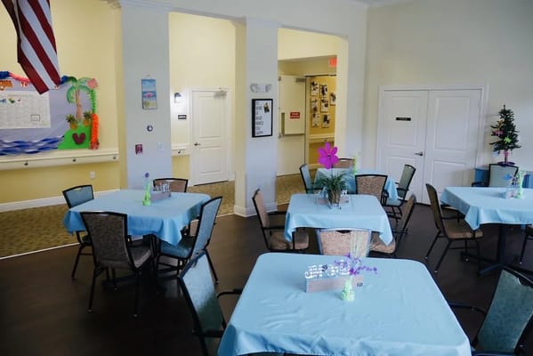 Bright dining room with blue table settings and decorations