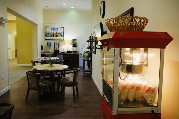 Interior dining area with popcorn machine and seating