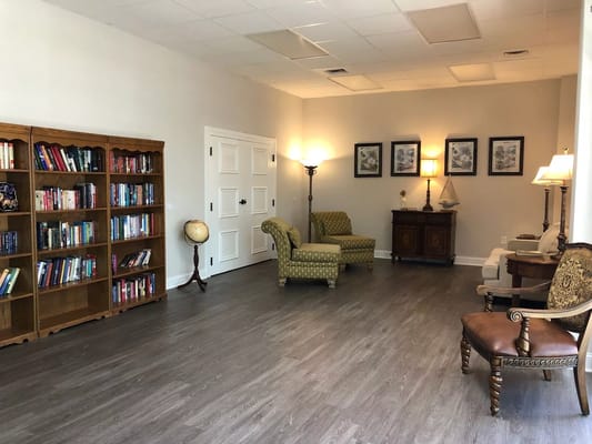 Interior common area with seating and bookshelves