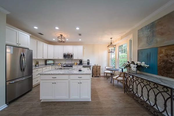 Bright and modern kitchen area with granite countertops