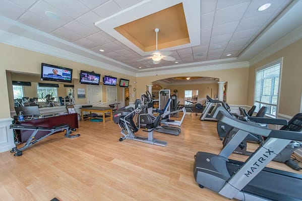 Well-equipped fitness room with exercise machines