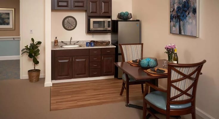 Cozy resident kitchen and dining area setup