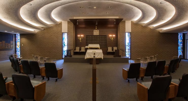 Interior view of a serene prayer space with seating