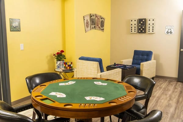 Interior activity room with a poker table