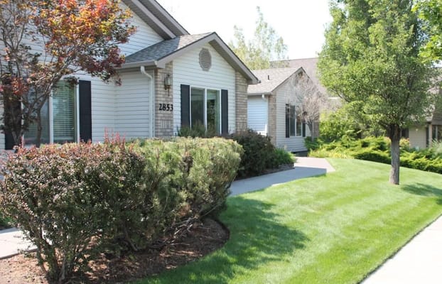 Exterior view of the facility with landscaped garden