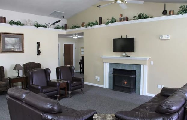 Cozy common area with seating and fireplace