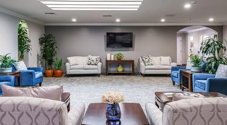 Bright interior lounge with seating and plants