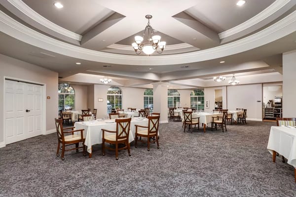 Dining area with tables and chairs in an elegant setting