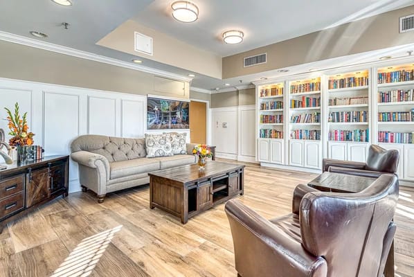 Bright common area with bookshelves and seating