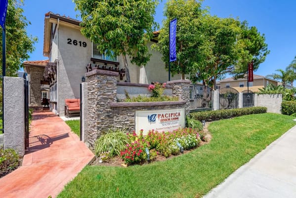 Front view of Pacifica Senior Living South Coast with signage.