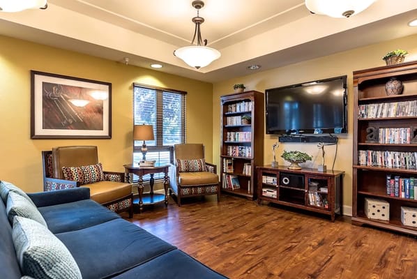 Common area with bookshelves and comfortable seating