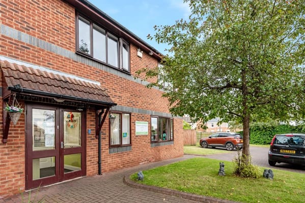Exterior view of the Paddock Stile Manor entrance