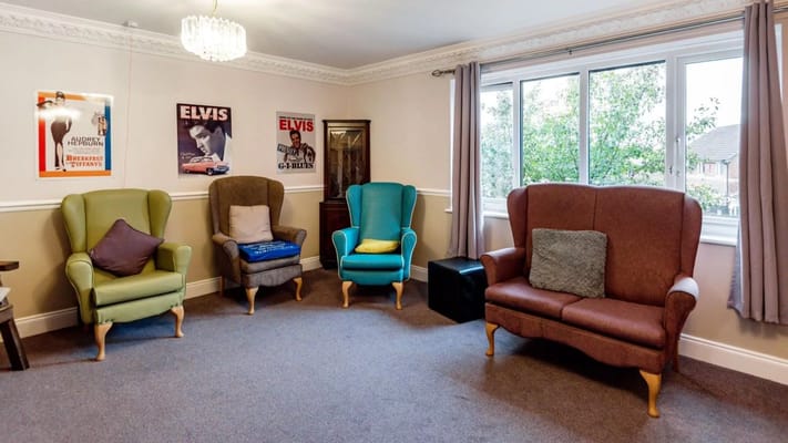 Cozy common area with comfortable seating and Elvis posters