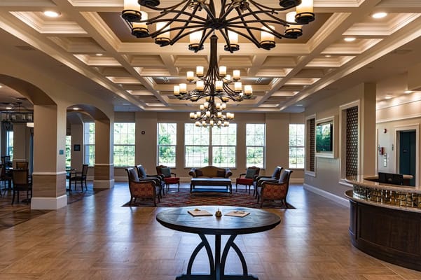 Bright and inviting common area with seating and chandelier