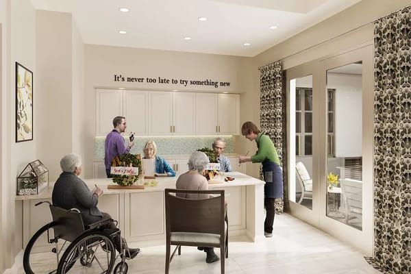 Residents and staff engaging in an activity in the facility's common area