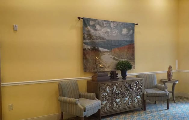 Interior view of a lounge area with art