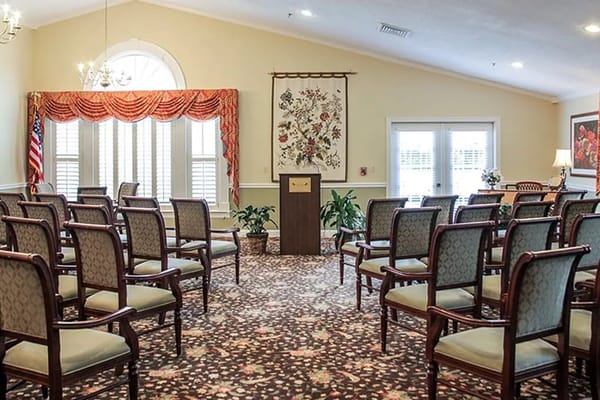 Empty community room with chairs and a podium