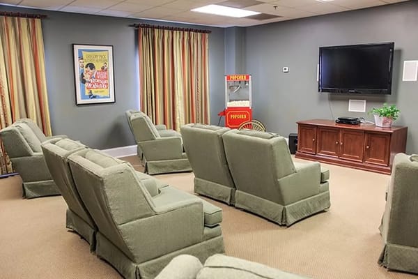 Comfortable seating in the community room with popcorn machine