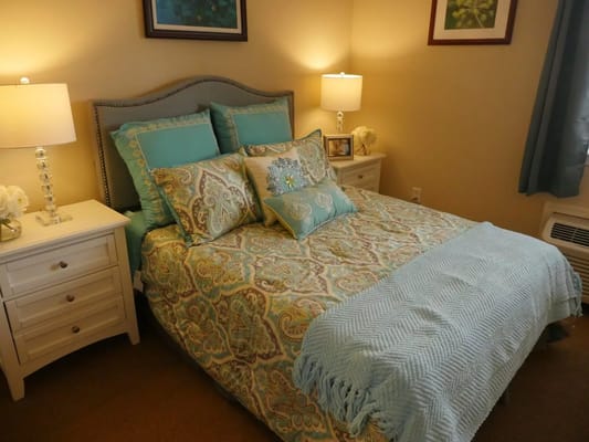 A cozy bedroom setup with decorative pillows