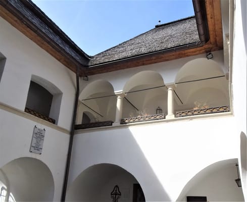 Interior courtyard with arches and wooden beams