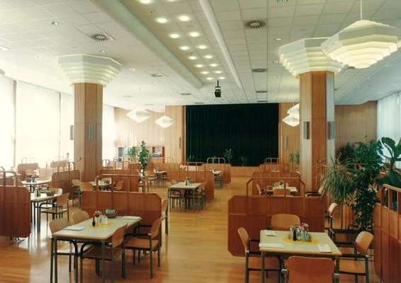 Bright dining room with wooden decor and tables