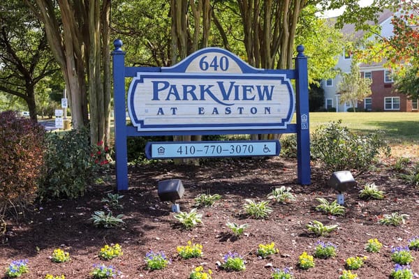 Sign for Park View At Easton with flowers in front