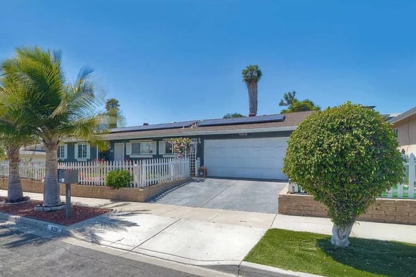 Exterior view of a senior living facility with landscaping