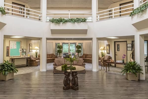 Spacious lobby area with seating and plants