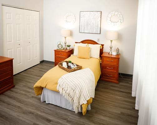 A well-decorated private resident room with bright colors