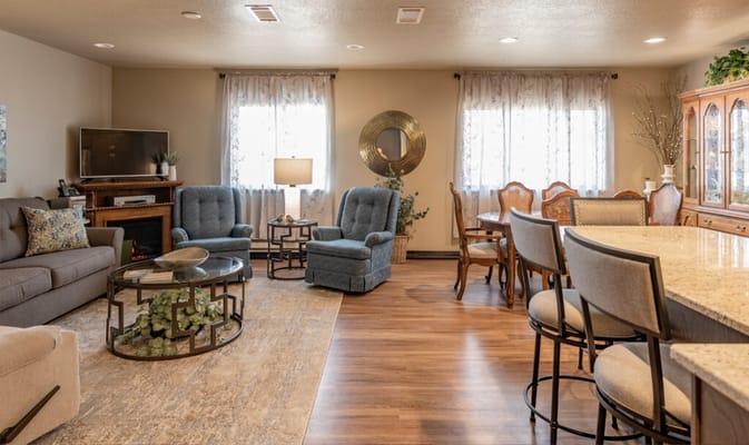 Cozy living room with comfortable seating and dining area.