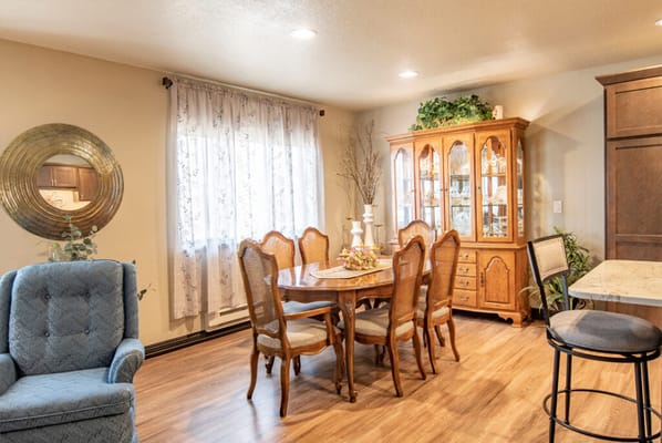 Cozy dining area with wooden table and chairs