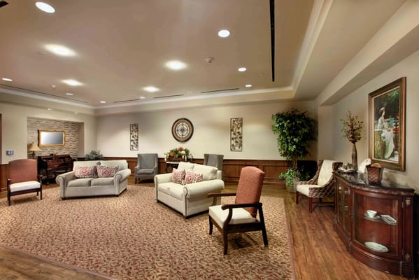 A cozy living room space with seating and decorative elements