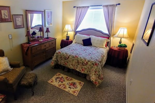Cozy private resident room with floral bedding