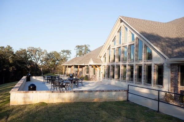 Exterior view of the Pate Rehabilitation Center with outdoor seating